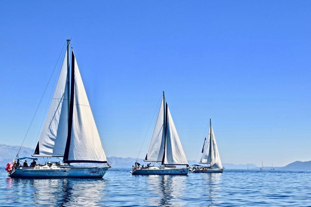 sailboats against blue sky and water