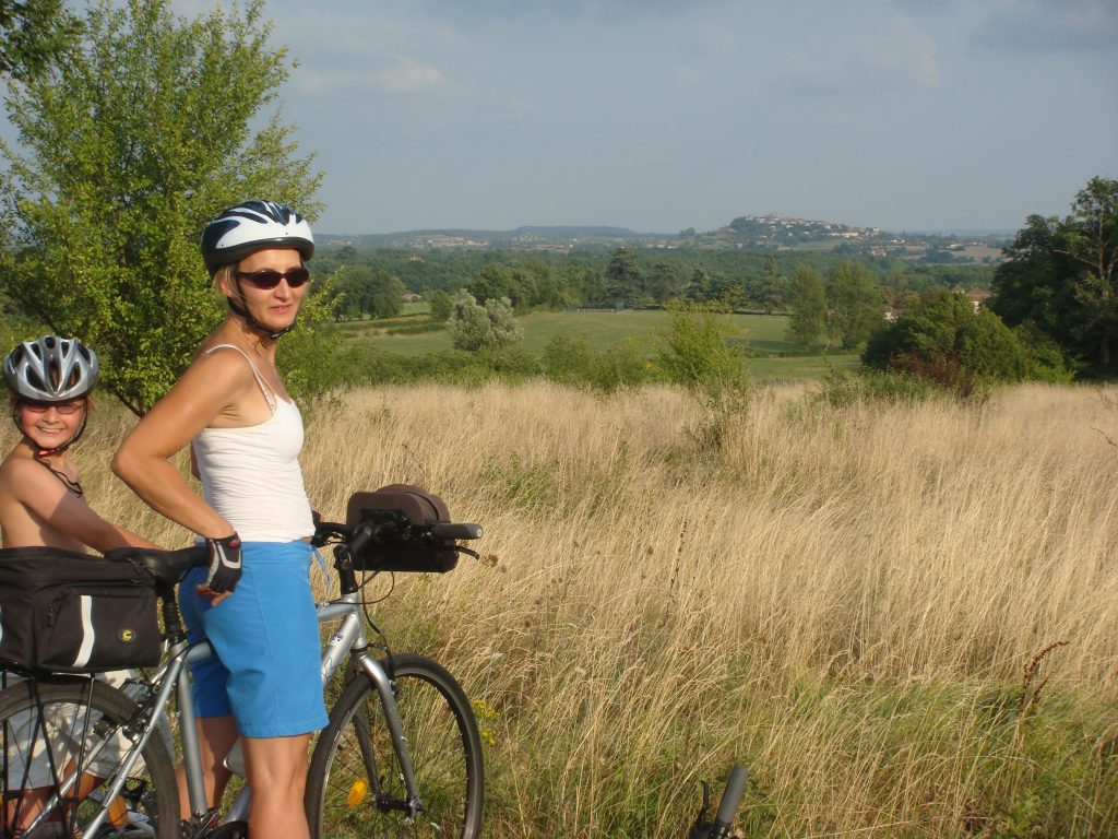 woman biking in French countryside